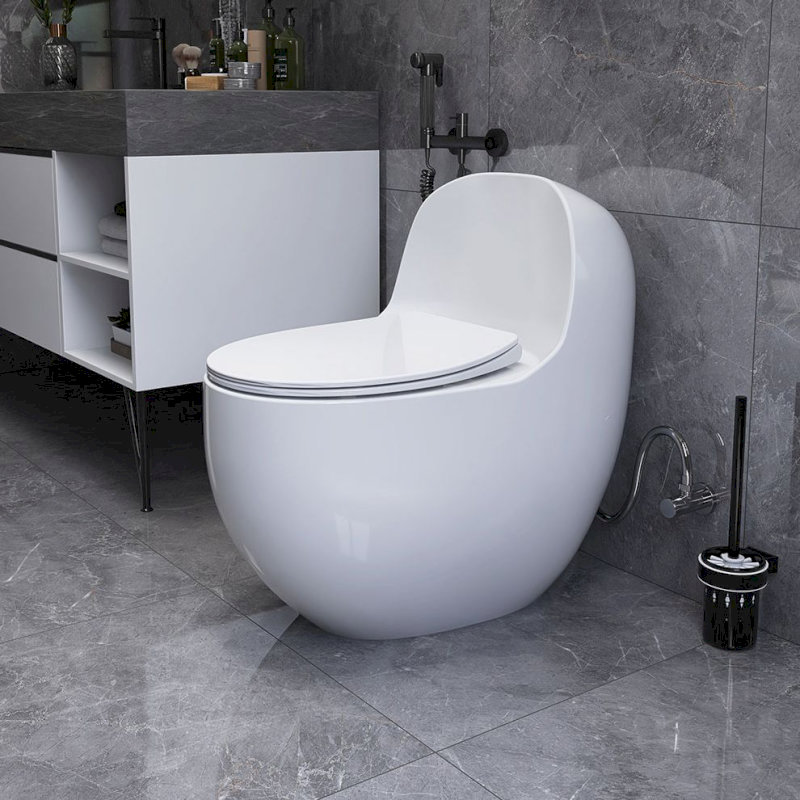 Bồn cầu thông minh Toto có màu trắng, nắp bồn cầu tự động nâng hạ. Thiết kế treo tường hiện đại, tiết kiệm không gian phòng tắm.
